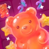 Glossy orange gummy bear candy on a bright pink merge puzzle board with sweet jelly treats and stars