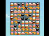 Colorful match puzzle board filled with cupcakes, cake slices, croissants, and chocolate desserts